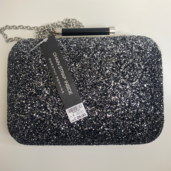 Dorothy Perkins Handbags - Black, silver glitter clutch. Chain can be easily removed. Hard shell.